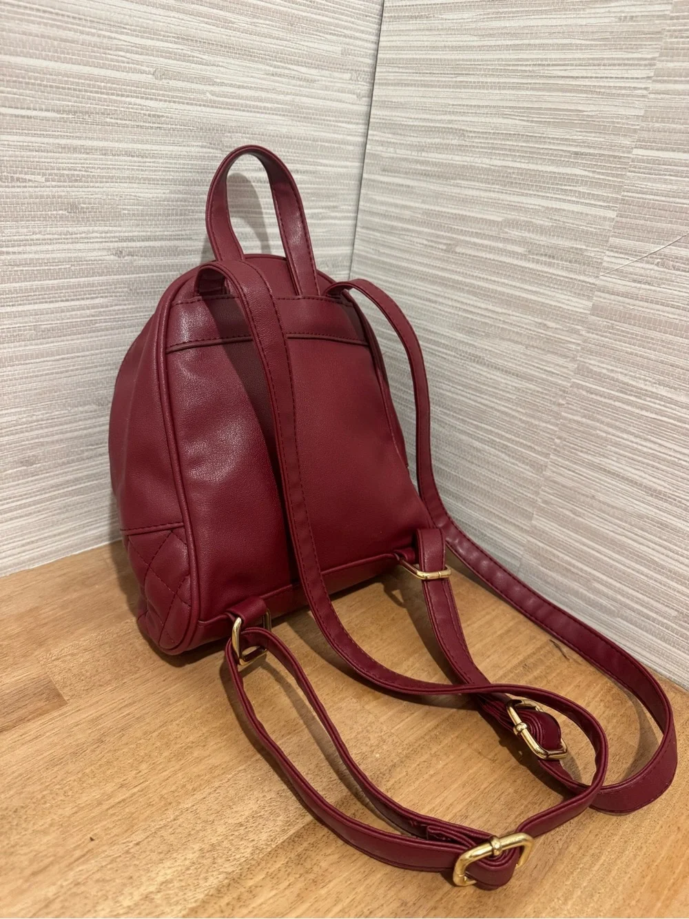 bebe Small Quilted Backpack in Burgundy with Gold Chain